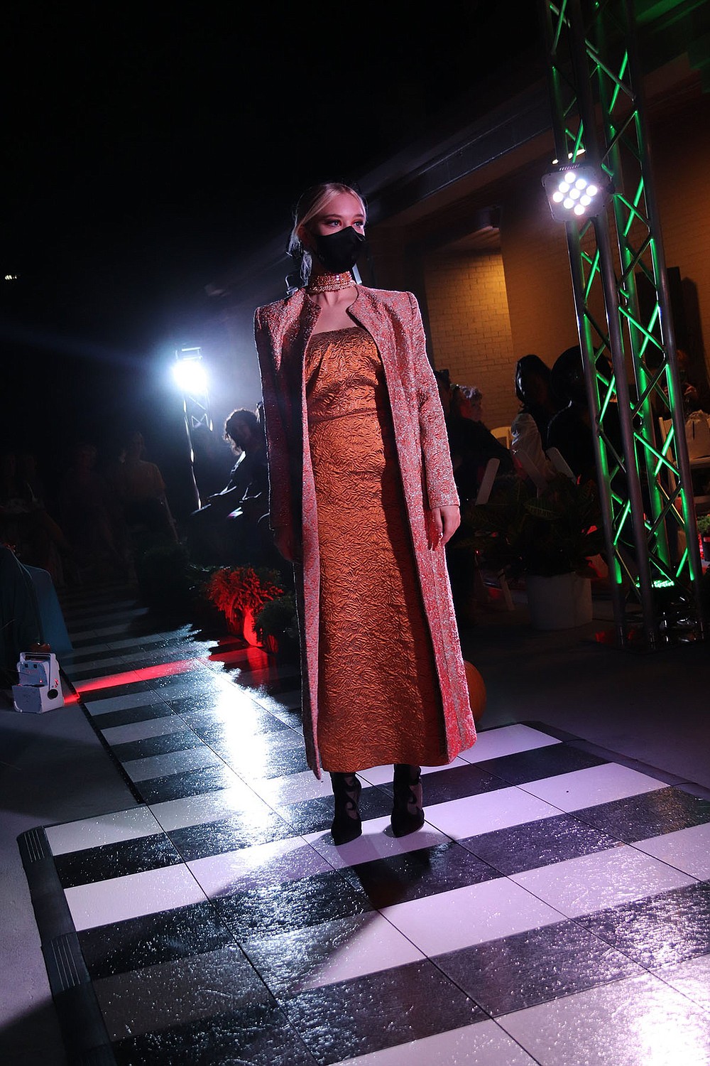 A chic dress and long coat displays the talents of graduate Charli Sotomora.
(Arkansas Democrat-Gazette/Helaine R. Williams)