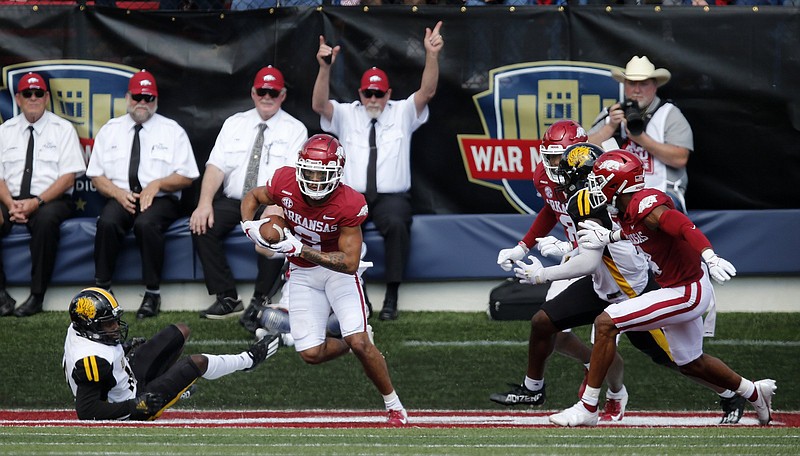 Arkansas defensive back Myles Slusher (2) intercepts a pass in the end zone during the second quarter of the Razorbacks’ 45-3 victory on Saturday at War Memorial Stadium in Little Rock. It was Slusher’s first collegiate interception.
(Arkansas Democrat-Gazette/Thomas Metthe)