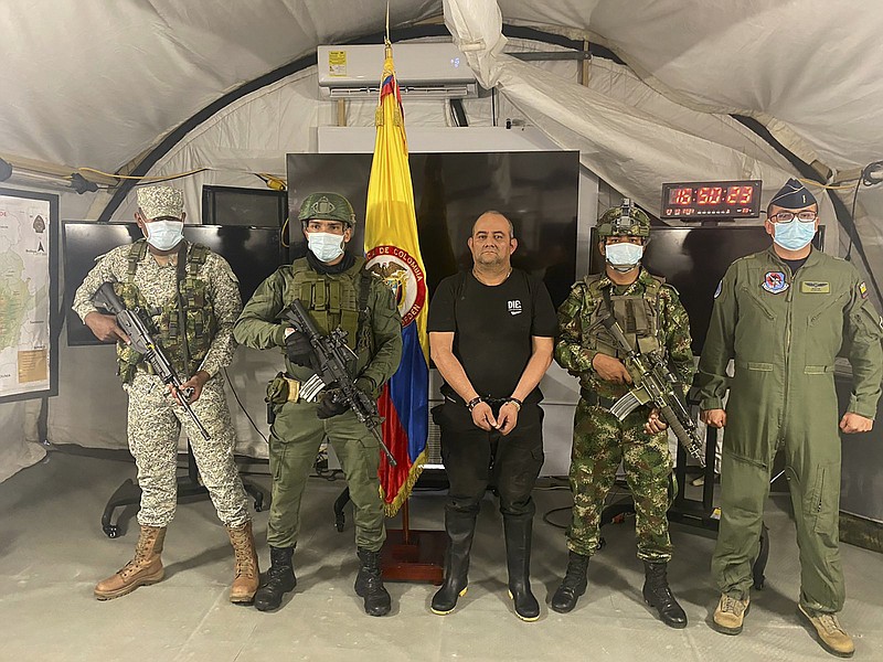 Dairo Antonio Usuga, leader of the violent Clan del Golfo cartel, is presented to the media at a military base Saturday, in Necocli, Colombia. Video at arkansasonline.com/1025otoniel/.
(AP/Colombian presidential press office)