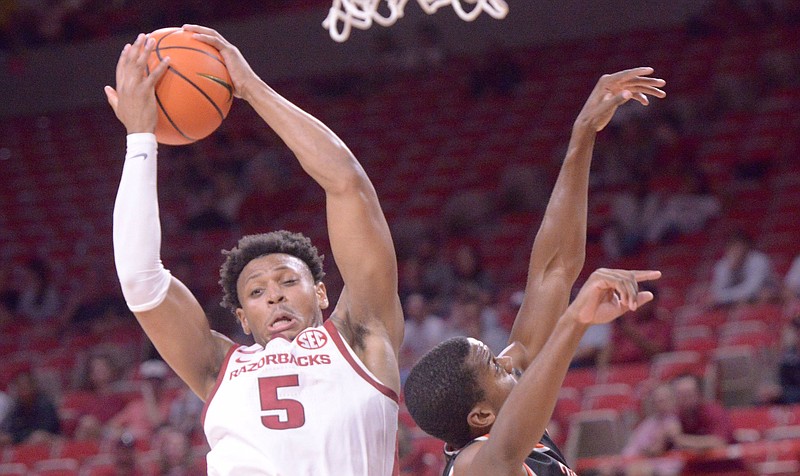 Au’Diese Toney of Arkansas comes down with a rebound in Sunday’s exhibition opener against East Central (Okla.) University on Sunday at Walton Arena in Fayetteville. Toney had 15 rebounds as the Razorbacks rallied from a 14-point deficit to win 77-74.
(NWA Democrat-Gazette/J.T. Wampler)