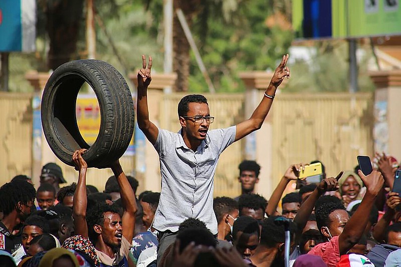 Thousands of pro-democracy protesters take to the streets to condemn a takeover by military officials in Khartoum, Sudan, Monday Oct. 25, 2021. (AP/Ashraf Idris)