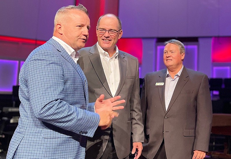 Pastor Larry D. White (left) of Woodland Heights Baptist Church in Conway was elected Wednesday to replace Hot Springs Baptist Church Pastor Mansley Beasley Jr. (center) as president of the Arkansas Baptist State Convention. After the annual meeting came to a close in Cabot, the two ministers were joined on stage by state convention executive director J.D. “Sonny” Tucker.
(Arkansas Democrat-Gazette/Frank Lockwood)