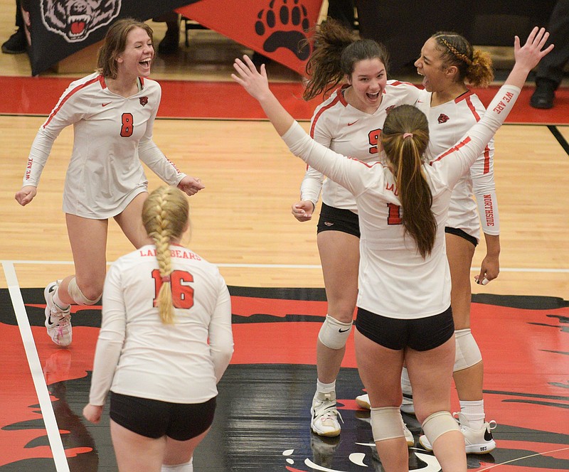 Fort Smith Northside players celebrate after defeating Rogers 3-1 (25-22, 25-20, 19-25, 25-14) in the opening round of the Class 6A State Volleyball Tournament Tuesday at Northside Arena. Go to nwaonline.com/211027Daily/ to see more photos. (NWA Democrat-Gazette/Hank Layton)