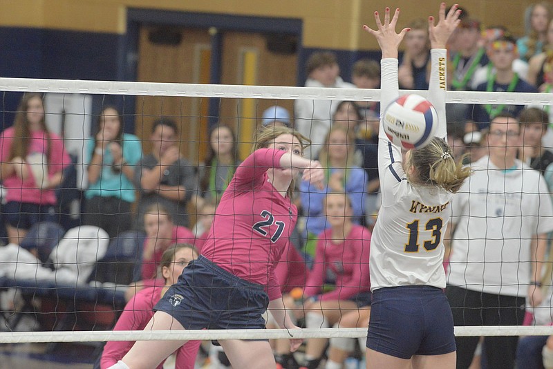 Shiloh Christian's Rylee Kallesen gets the ball past Wynne's Bree Pardy Tuesday Oct. 26, 2021 during the first round of the 4A Volleyball Tournament in Springdale. Shiloh won in three sets. (NWA Democrat-Gazette/J.T. Wampler)