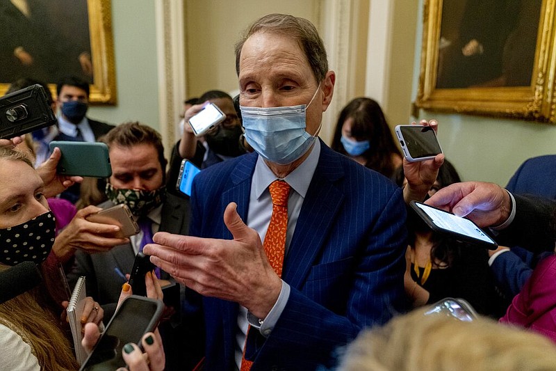 Sen. Ron Wyden, D-Ore., speaks to reporters following a Democratic strategy meeting at the Capitol in Washington, Tuesday, Oct. 26, 2021. (AP/Andrew Harnik)