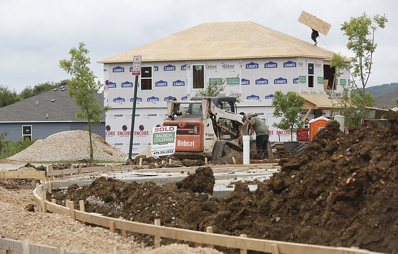 New home construction continues Monday, July 12, 2021 in the Park Meadows subdivision on E. Swift Drive in Fayetteville. (NWA Democrat-Gazette/David Gottschalk)