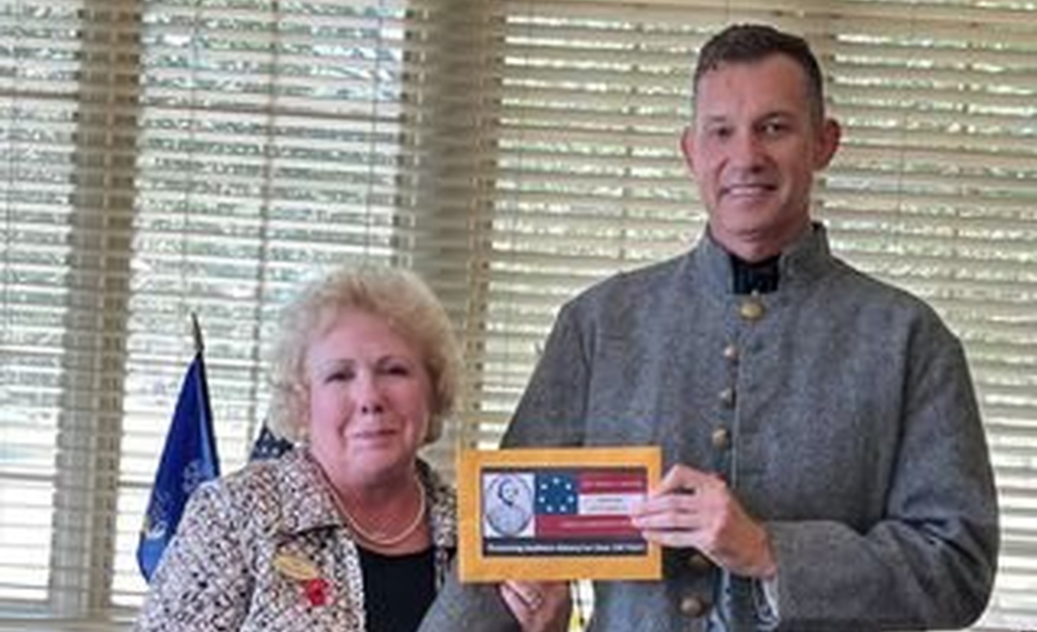 Historical groups present donations for wreath ribbons