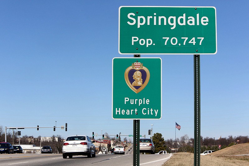 A sign post marking the city limits of Springdale Thursday, February 16, 2017, on South Thompson Boulevard in Springdale. (NWA Democrat-Gazette File Photo/DAVID GOTTSCHALK)