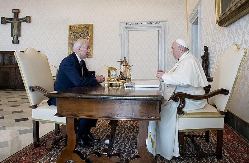 President Joe Biden meets with Pope Francis at the Vatican on Friday in talks that ran overtime and included an exchange of gifts. Biden and Francis had previously met three times, but this was the first since Biden became president. More photos at arkansasonline.com/1030g20vatican/.
(AP/Vatican Media)
