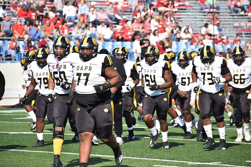 UAPB football players race off the field after warmups for their Oct. 23 game against the University of Arkansas at War Memorial Stadium in Little Rock. The Golden Lions are taking on Texas Southern this week after their spring 2021 matchup was canceled due to issues with covid-19. 
(Pine Bluff Commercial/I.C. Murrell)