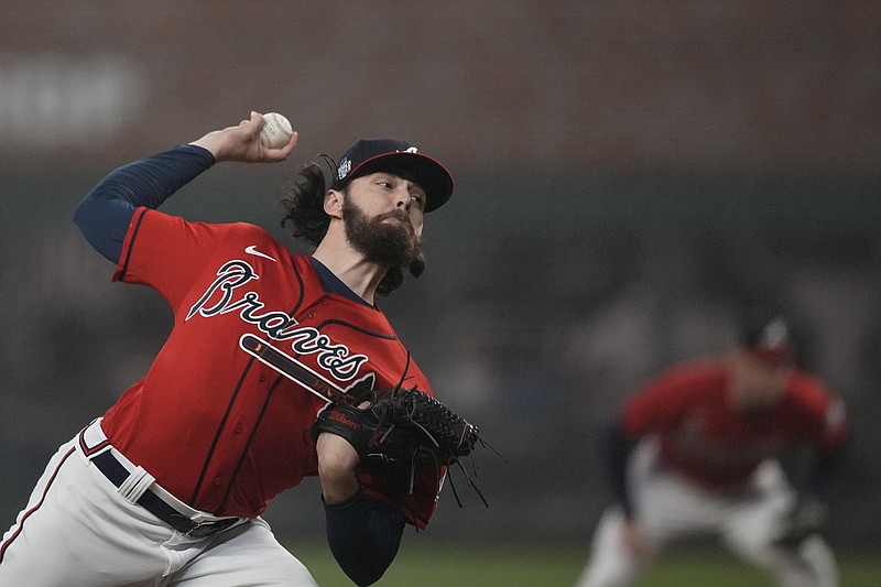 Atlanta Braves rookie right-hander Ian Anderson delivers a pitch during the Braves’ victory over the Houston Astros on Friday night in Game 3 of the World Series in Atlanta. Anderson and the Braves’ bullpen took a no-hitter into the eighth inning. More photos available at arkansasonline.com/1030mlb21.
(AP/David J. Phillip)