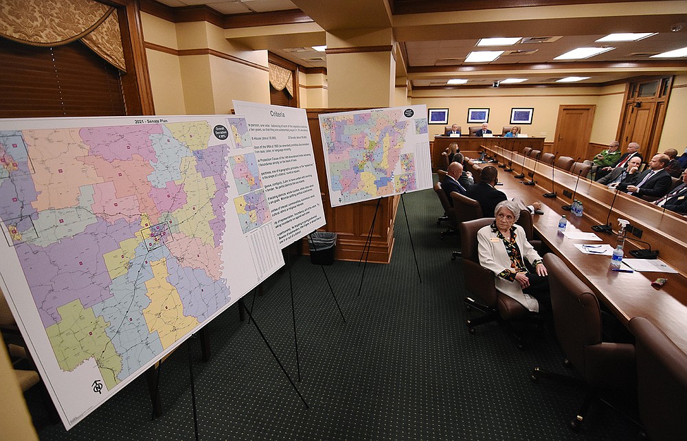 Former state Supreme Court Chief Justice Betty Dickey, redistricting coordinator for the Arkansas Board of Apportionment, looks over the new state legislative redistricting maps Friday as the board met to approve the redrawn House and Senate districts.
(Arkansas Democrat-Gazette/Staci Vandagriff)