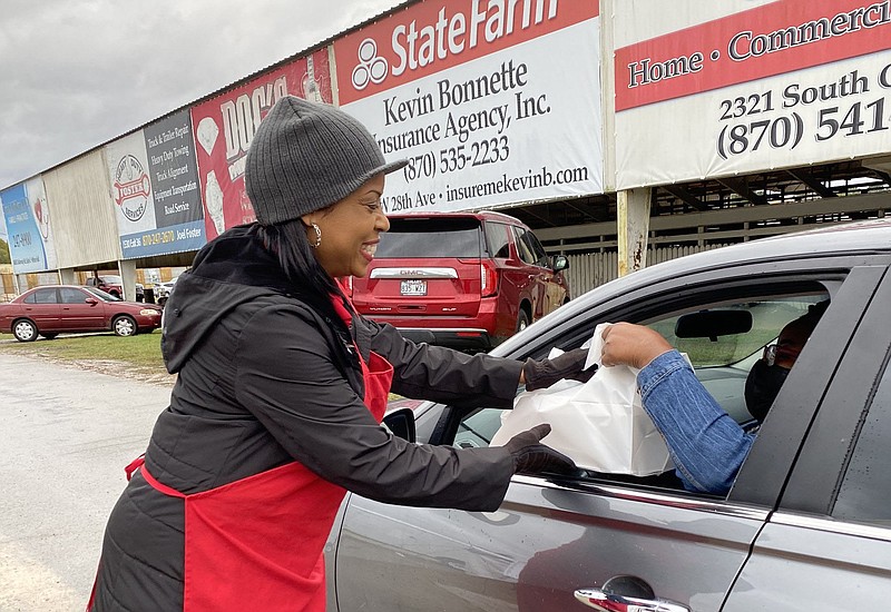 Barbara Dunn, a volunteer for the Pine Bluff Regional Chamber of Commerce’s Farmers Appreciation Fish Fry, works Thursday to keep up with the demand for King Kat catfish. 
(Special to The Commercial)