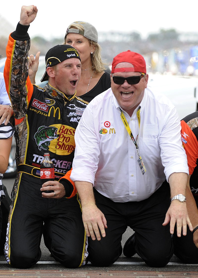 Owner Chip Ganassi (right) and Jamie McMurray celebrate McMurray’s victory in the Brickyard 400 at Indianapolis Motor Speedway in 2010. Ganassi will close his 20-year run in NASCAR with Sunday’s season finale.
(AP file photo)