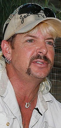 In this Aug. 28, 2013, file photo, Joseph Maldonado-Passage, also known as Joe Exotic, answers a question during an interview at the zoo he runs in Wynnewood, Okla. 
(AP Photo/Sue Ogrocki, File)
