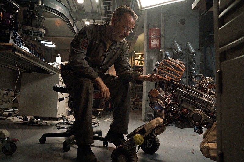 The last man on Earth, ailing inventor Finch Weinberg (Tom Hanks), invents an android to accompany him and and his dog on a trek across the post-apocalyptic landscape in “Finch.”