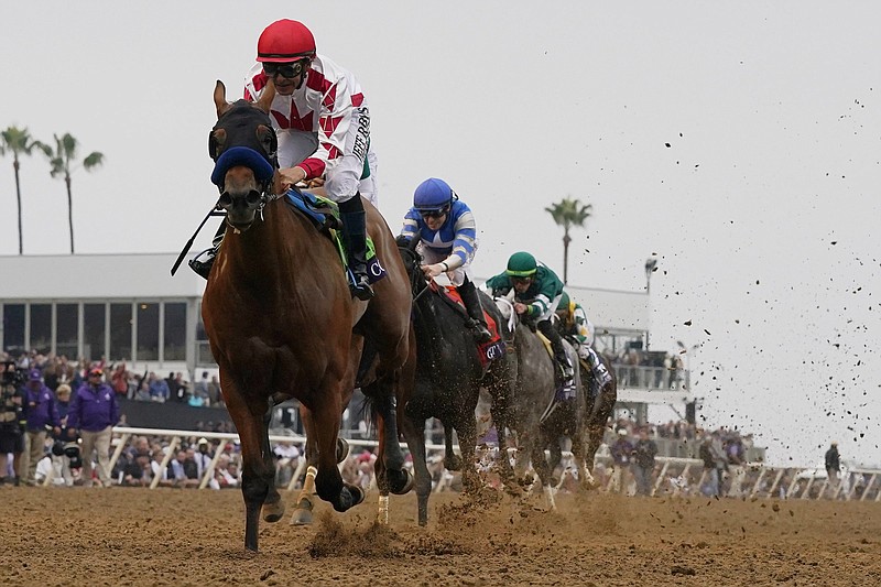 Mike Smith rides Corniche to win the Breeders’ Cup Juvenile by 1 3/4 lengths Friday at the Del Mar Racetrack in Del Mar, Calif. Corniche, the 7-5 favorite, ran 1 1/16 miles in 1:42.50.
(AP/Gregory Bull)