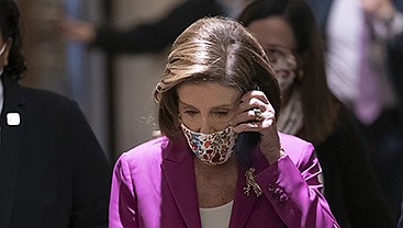 House Speaker Nancy Pelosi arrives Friday on Capitol Hill. “We are not a lockstep party,” Pelosi said of bitter internal divisions over the spending bills.
(AP/J. Scott Applewhite)