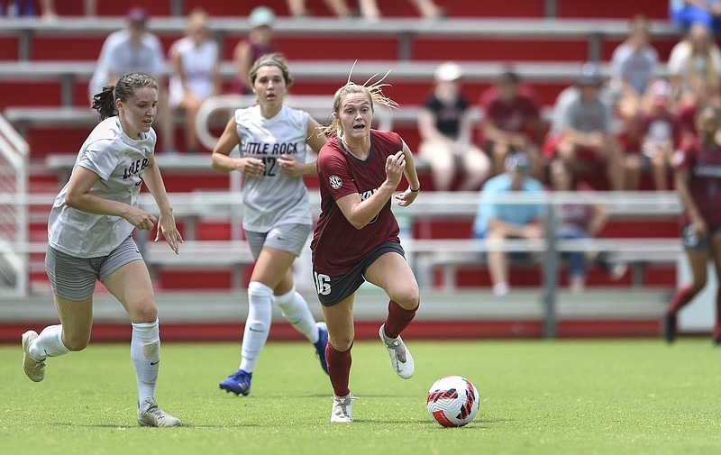 Arkansas forward Anna Podojil (16) leads the ball, Sunday, August 8, 2021 during a soccer scrimmage at Razorback Field in Fayetteville. Check out nwaonline.com/210809Daily/ for today's photo gallery. .(NWA Democrat-Gazette/Charlie Kaijo)