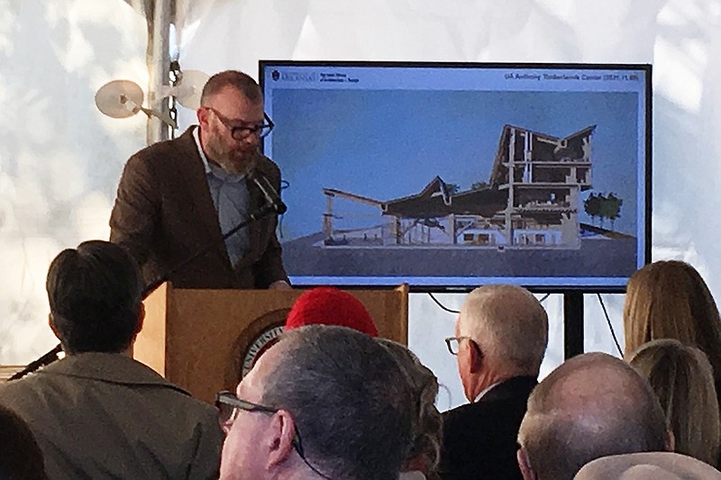 Jason Wright, with Modus Studio, describes architectural renderings of the Anthony Timberlands Center for Design and Materials Innovation on Friday at the University of Arkansas, Fayetteville.
(Arkansas Democrat-Gazette/Jaime Adame)