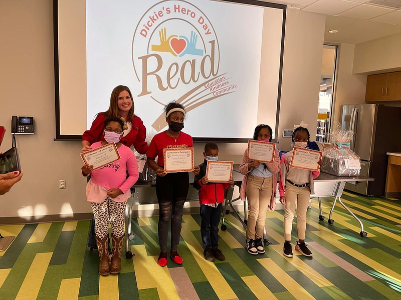 Brandy Weatherly, the daughter of Richard Dennis “Dickie” Ratliff, stands with a group of winners at the inaugural Dickie’s Hero Day ceremony at the Jefferson County/Pine Bluff Library. 
(Special to the Commercial)