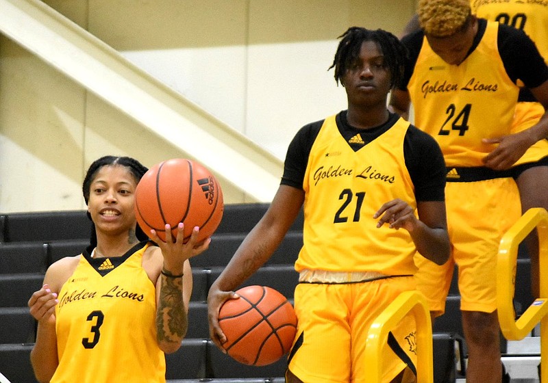 UAPB players Joyce Kennerson (3), Takaylyn Busby (21) and Bryana Langford (24) practice shooting a promotional video for social media Sunday at H.O. Clemmons Arena. After tearing her ACL in January, Kennerson is hoping to have a rebound season. 
(Pine Bluff Commercial/I.C. Murrell)