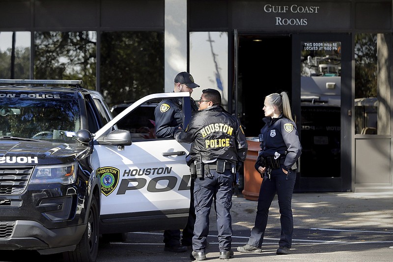 Houston police stand outside the Wyndham Hotel Saturday, where they posted a staging area for people looking for family and friends after the concert at Astroworld.
(AP/Michael Wyke)