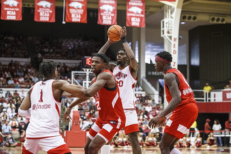 Arkansas Junior Kamani Johnson (20) with the ball on Sunday, Oct. 17, 2021, during the second half of play at Barnhill Arena, Fayetteville. Visit nwaonline.com/211018Daily/ for today's photo gallery..(Special to the NWA Democrat-Gazette/David Beach)