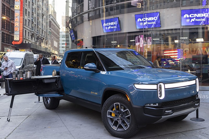 A Rivian R1T all-electric truck is displayed Wednesday in Times Square. Shares of Rivian Automotive jumped in their debut Wednesday, rising as much as 53%.
(Ann-Sophie Fjello-Jensen/AP Images for Rivian Automotive, LLC)