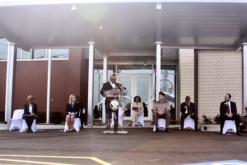 Pine Bluff Mayor Shirley Washington (from left), Arkansas Attorney General Leslie Rutledge, the Rev. Steven King, County Judge Gerald Robinson, retired U.S. Air Force Master Sgt. Michelle Harleston, Pine Bluff Arsenal Commander Col. Patrick S. Daulton, P3 Group CEO Dee Brown and Simmons Bank Regional Community President Daniel Robinson attend a dedication ceremony for the Sgt. Elga Lee Roberts Jefferson County Veterans Service Office. More photos at arkansasonline.com/1111pbvets/. 
(Pine Bluff Commercial/Eplunus Colvin)