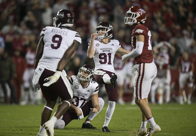 Mississippi State kicker Nolan McCord (91) watches his potential game-tying field goal sail wide left on the final play of the Bulldogs’ loss to Arkansas on Saturday at Reynolds Razorback Stadium in Fayetteville. Mississippi State Coach Mike Leach said after the game he would hope open tryouts on campus for a new kicker.
(NWA Democrat-Gazette/Charlie Kaijo)