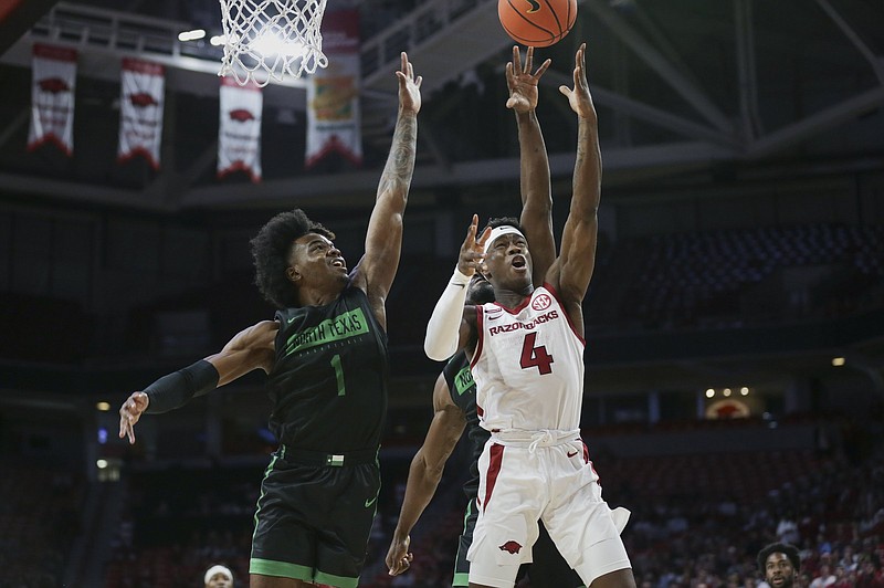 Arkansas sophomore guard Davonte Davis (4), shown during an exhibition game on Oct. 30, was one of the Razorbacks’ top weapons during their NCAA Tournament run last season. However, during their season-opening victory over Mercer on Wednesday, he did not attempt a shot or free throw.
(NWA Democrat-Gazette/Charlie Kaijo)