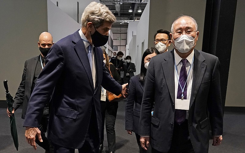 U.S. climate envoy John Kerry and China’s counterpart Xie Zhenhua continue to negotiate Friday in Glasgow, Scotland. Kerry said the late-night talks were “working away.”
(AP/Alberto Pezzali)