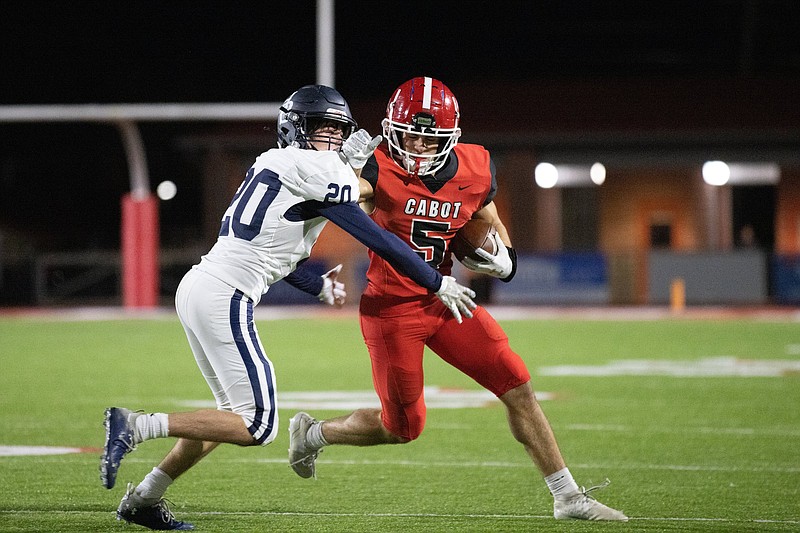 Cabot wide receiver Braden Jay (right) tries to fend off Springdale Har-Ber’s Sutton Reeh in a first-round playoff game Friday at Panther Stadium in Cabot. More photos at arkansasonline.com/1113shbchs/
(Arkansas Democrat-Gazette/Justin Cunningham)