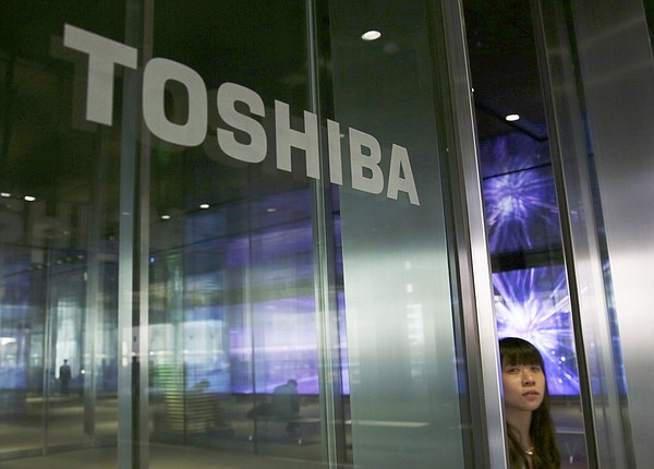 Toshiba spins off personal computer gadget, strength divisions