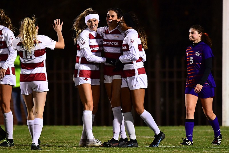 Ava Tankersley (center) is congratulated by her teammates after scoring in the first half of Arkansas’ 5-1 victory over Northwestern (La.) State on Friday night at Razorback Field in Fayetteville.
(Photo courtesy Arkansas Athletics)