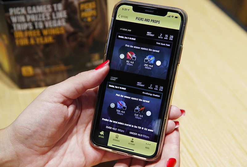 A mobile sports betting app for football games is displayed at a Buffalo Wild Wings in Las Vegas in this Sept. 5, 2019, file photo. (AP/John Locher)