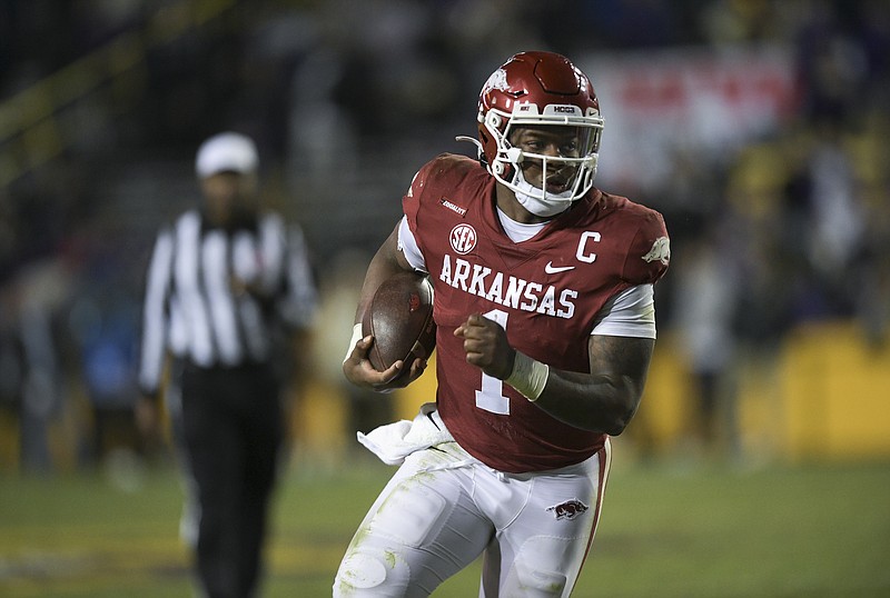 Arkansas quarterback KJ Jefferson (1) carries the ball, Saturday, November 13, 2021 during overtime of a football game at Tiger Stadium in Baton Rouge, La. Check out nwaonline.com/211114Daily/ for today's photo gallery. (NWA Democrat-Gazette/Charlie Kaijo)