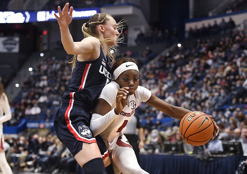 Arkansas' Marquesha Davis, right, is guarded by Connecticut's Paige Bueckers in the first half of an NCAA college basketball game, Sunday, Nov. 14, 2021, in Hartford, Conn. (AP Photo/Jessica Hill)
