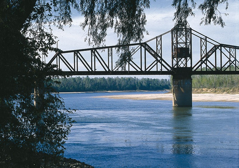 The lower Arkansas River flows past the Yancopin Bridge, part of the Delta Heritage Trail, in Desha County in this undated file photo.