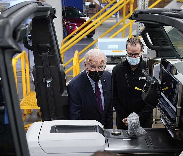 President Joe Biden tours the General Motors Factory ZERO electric vehicle assembly plant Wednesday in Detroit. The plant, built in 1985, has been reconfigured to build electric trucks and SUVs.
(AP/Evan Vucci)