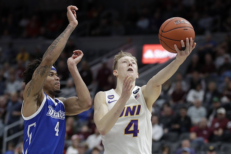 FILE - In this March 6, 2020, file photo, Northern Iowa's AJ Green, right, heads to the basket as Drake's Anthony Murphy defends during the second half of an NCAA college basketball game in the quarterfinal round of the Missouri Valley Conference men's tournament in St. Louis. (AP Photo/Jeff Roberson, File)