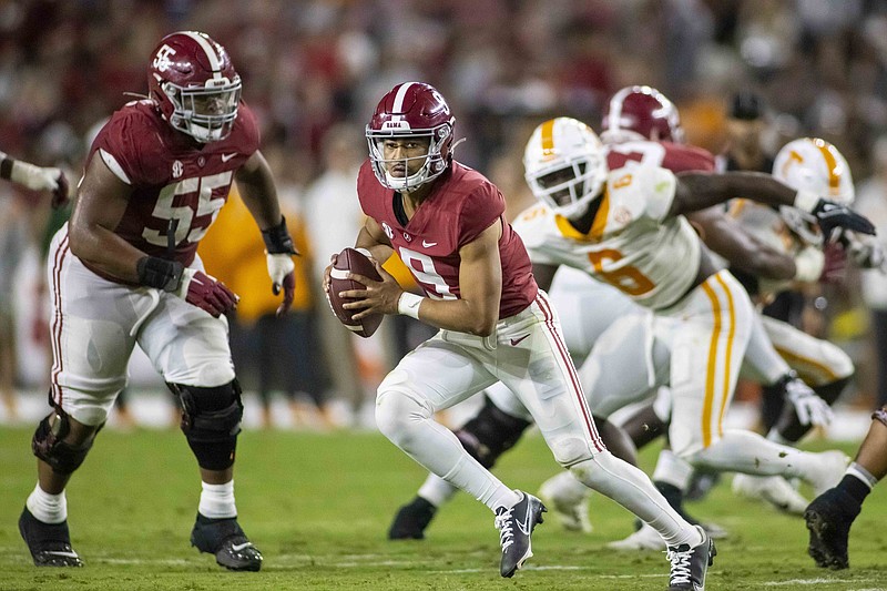 Alabama quarterback Bryce Young (9) runs the ball against Tennessee during the first half of an NCAA college football game Saturday, Oct. 23, 2021, in Tuscaloosa, Ala. (AP Photo/Vasha Hunt)