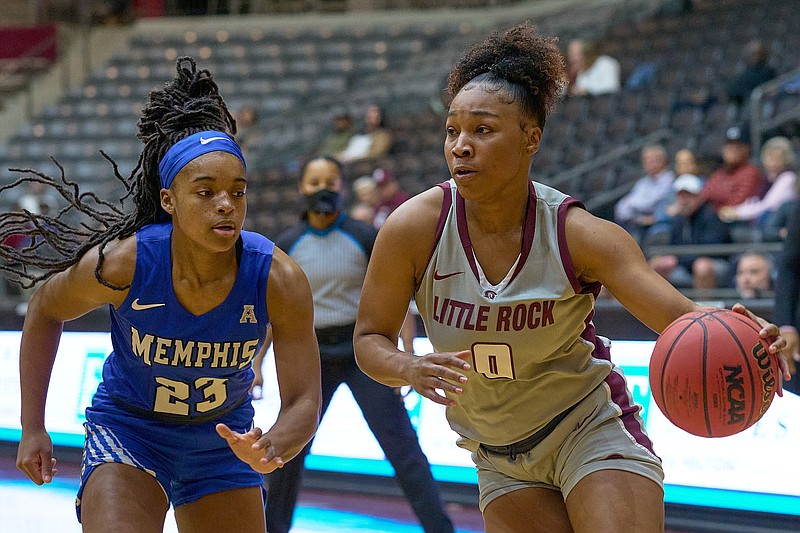 UALR guard Raziya Potter (right) drives to the basket Thursday while being defended by Memphis guard Jamirah Shutes during the Trojans’ 55-50 victory over the Tigers at the Jack Stephens Center in Little Rock.
(Photo courtesy UALR Athletics)