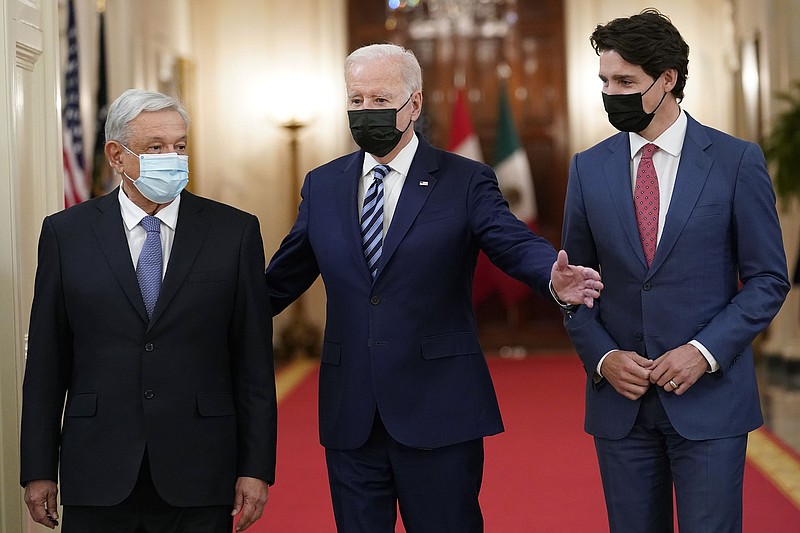 President Joe Biden (center) walks with Mexican President Andres Manuel Lopez Obrador (left) and Canadian Prime Minister Justin Trudeau during a meeting Thursday at the White House. More photos at arkansasonline.com/1119dcsummit/.
(AP/Susan Walsh)