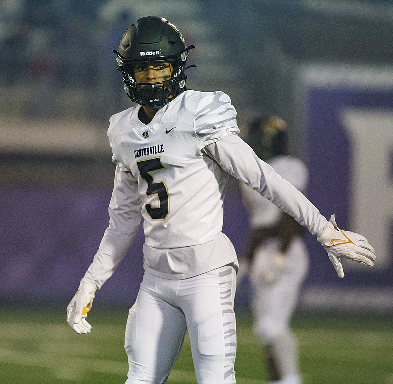 Bentonville senior receiver Chas Nimrod looks to get the play in a game earlier this season. Nimrod has committed to the University of Tennessee and plans to enroll early. The Tigers host North Little Rock in the second round of the Class 7A playoffs tonight in Tiger Stadium.
(Special to the NWA Democrat-Gazette/David Beach)