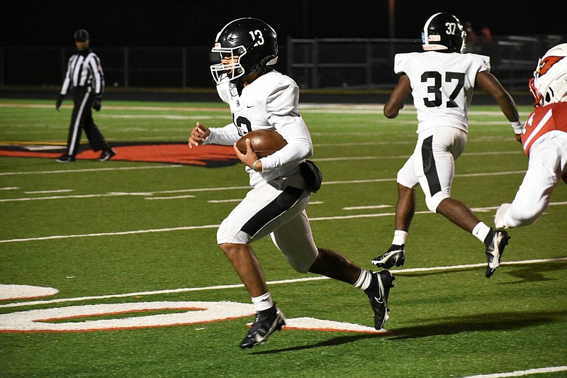 White Hall quarterback Mathew Martinez keeps the ball for a gain against Camden Fairview on Friday in Camden. The Bulldogs picked up a 35-14 win and will be headed to the third round of the playoffs for the third consecutive year. 
(Pine Bluff Commercial/I.C. Murrell)