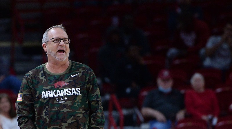 Arkansas coach Mike Neighbors directs his players Friday, Nov. 12, 2021, during the first half of play against UAPB in Bud Walton Arena in Fayetteville. 
(NWA Democrat-Gazette/Andy Shupe)