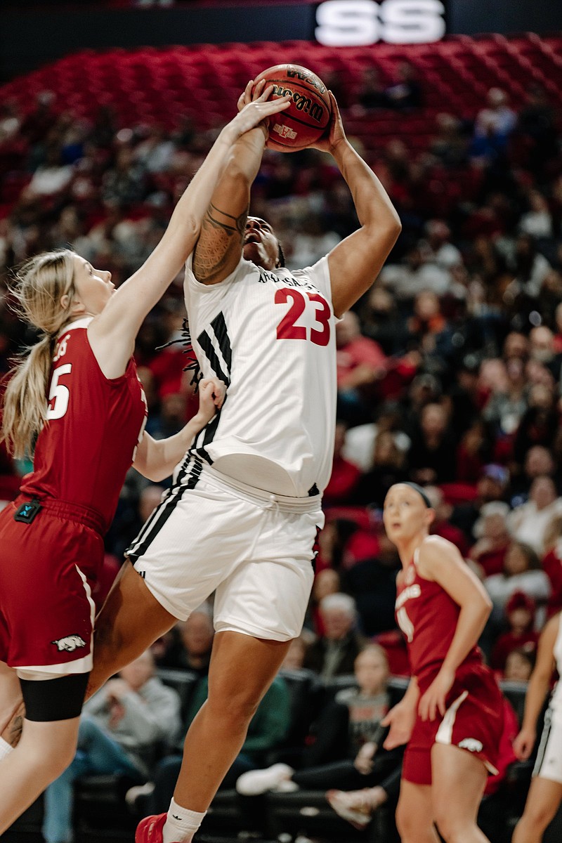 Arkansas State forward Trinitee Jackson (23) goes up for a shot Friday against Arkansas forward Emrie Ellis during the Red Wolves’ 94-71 loss the Razorbacks at First National Bank Arena in Jonesboro.
(Arkansas State Athletics/Meagan Johnson)