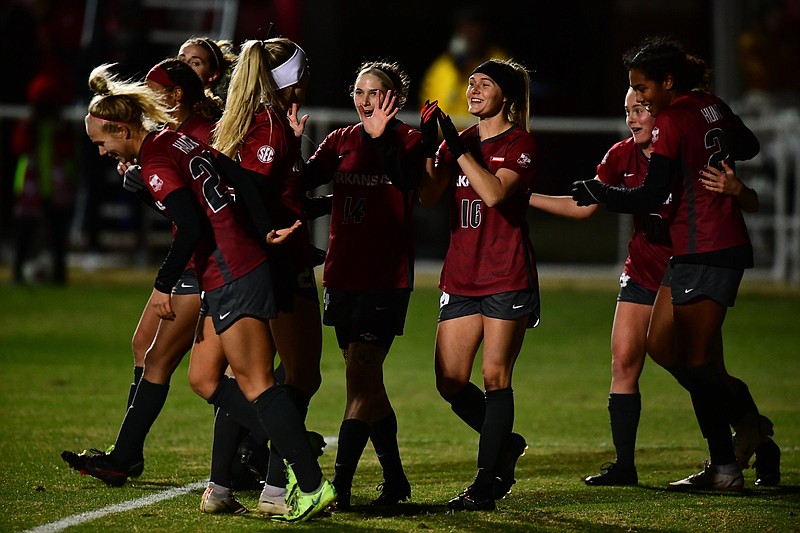 Arkansas players celebrate after Friday night’s victory over Virginia Tech in the second round of the NCAA Women’s Soccer Tournament in Fayetteville. The Razorbacks face Notre Dame on Sunday.
(Photo courtesy of the University of Arkansas)